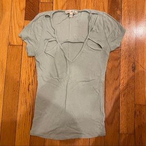 Ribbed light blue shirt with cutouts